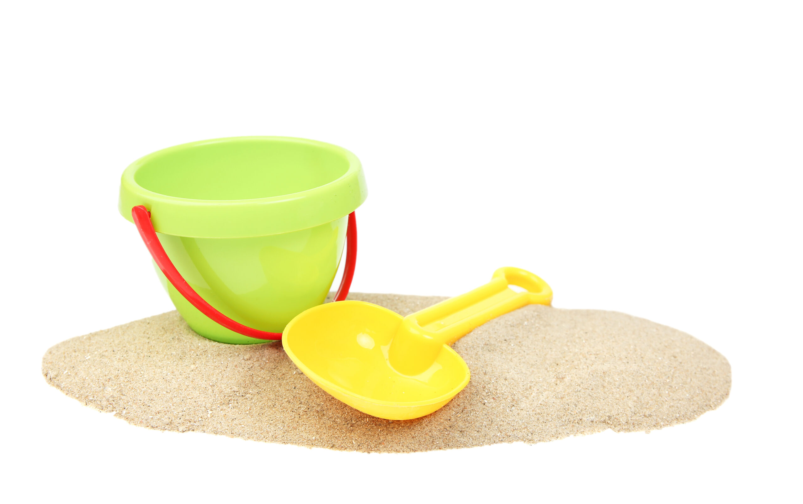 Plastic bucket and showel on sand isolated island.